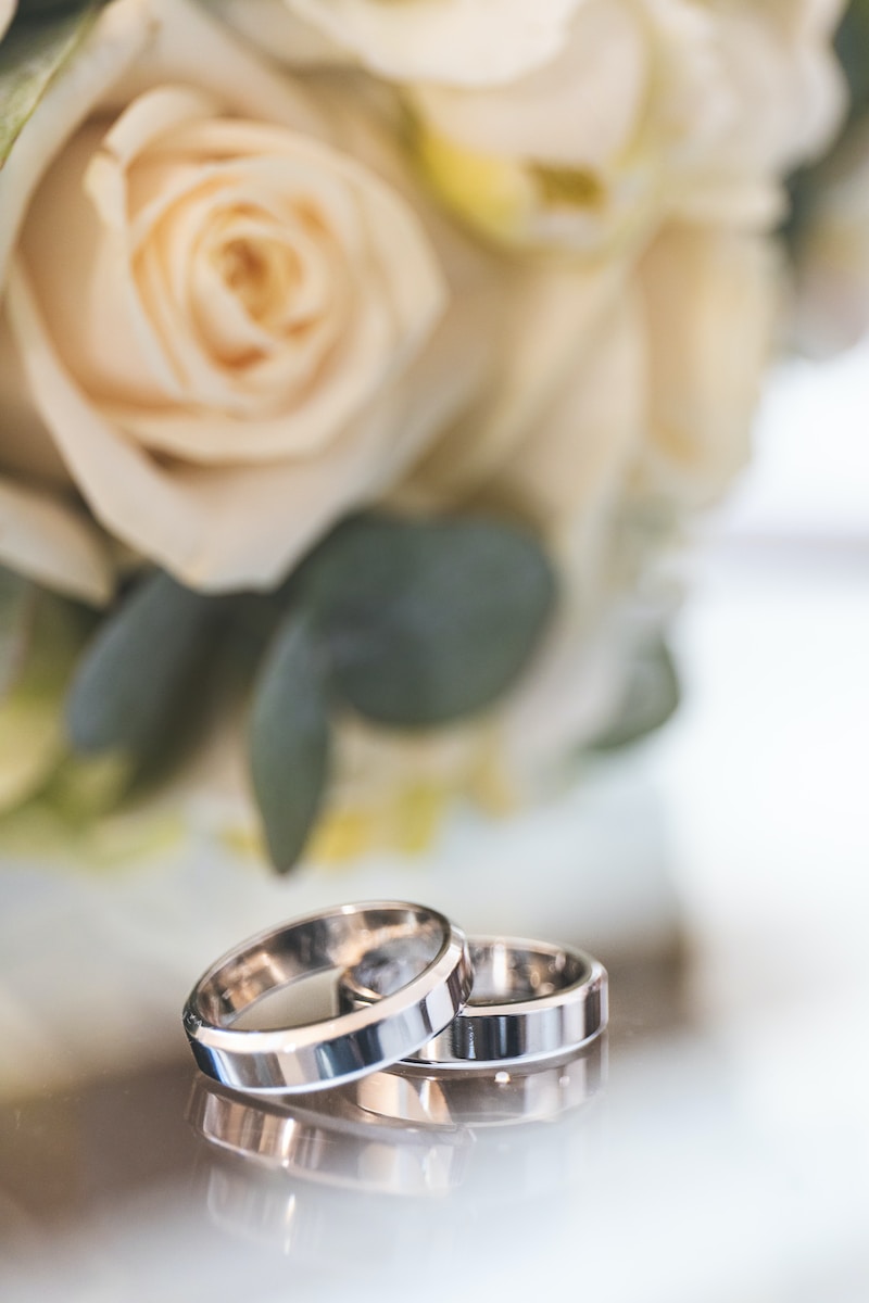 silver-colored wedding bands